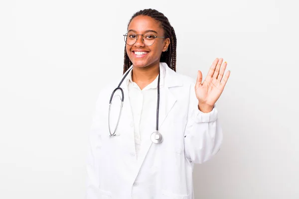 Young Adult Black Woman Smiling Happily Waving Hand Welcoming Greeting — Stock Fotó