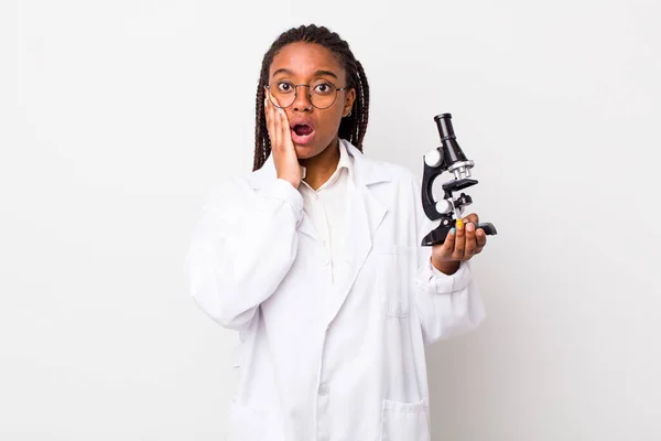Young Adult Black Woman Feeling Shocked Scared Sciencist Microscope — Fotografia de Stock