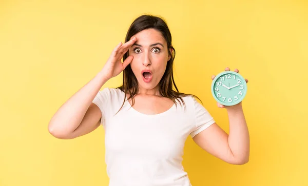 Young Adult Pretty Woman Looking Happy Astonished Surprised Alarm Clock — Stockfoto
