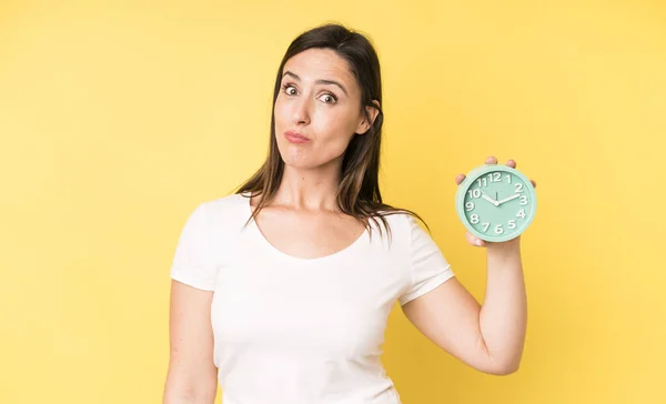 Young Adult Pretty Woman Shrugging Feeling Confused Uncertain Alarm Clock — Foto de Stock