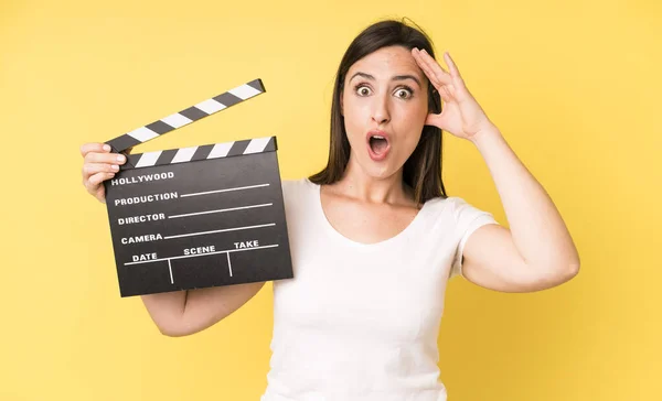 Young Adult Pretty Woman Looking Happy Astonished Surprised Cinema Clapper — Stock Photo, Image