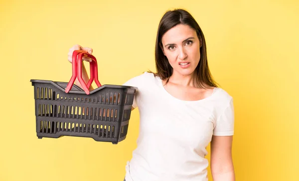 Young Adult Pretty Woman Feeling Puzzled Confused Shopping Basket Concept — 스톡 사진