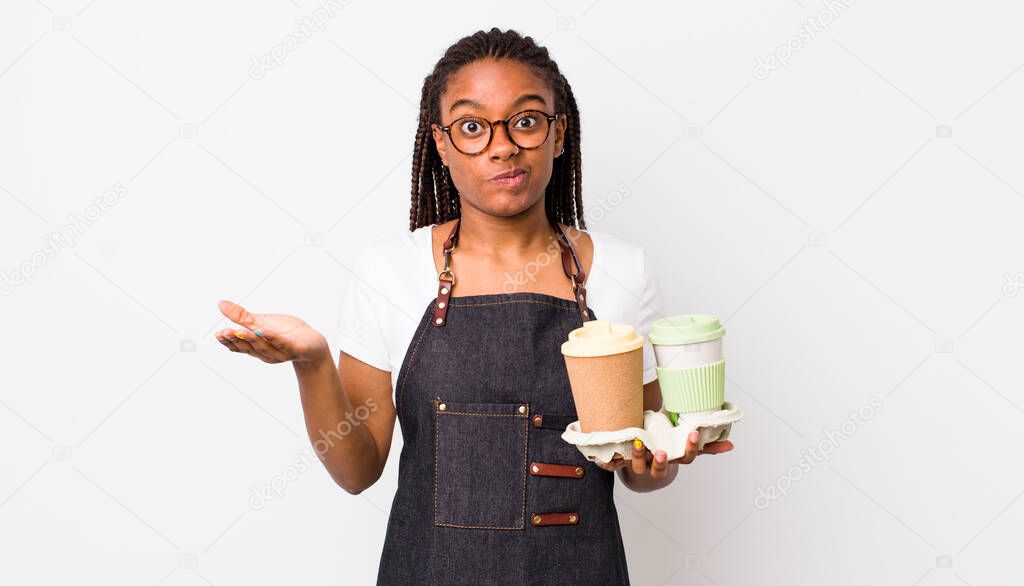 young adult black woman feeling puzzled and confused and doubting. take away coffees concept