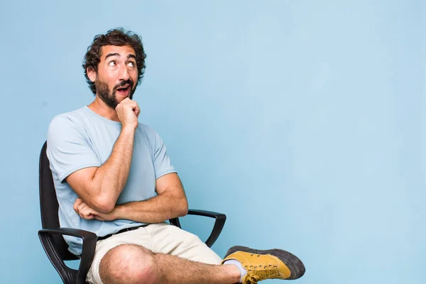 Young Adult Hispanic Crazy Man Sitting Chair Copy Space Concept — Stock Photo, Image