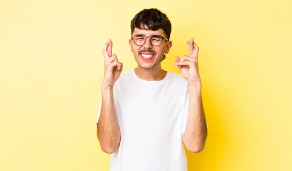 Young Adult Hispanic Man Feeling Nervous Hopeful Crossing Fingers Praying — Stock Photo, Image