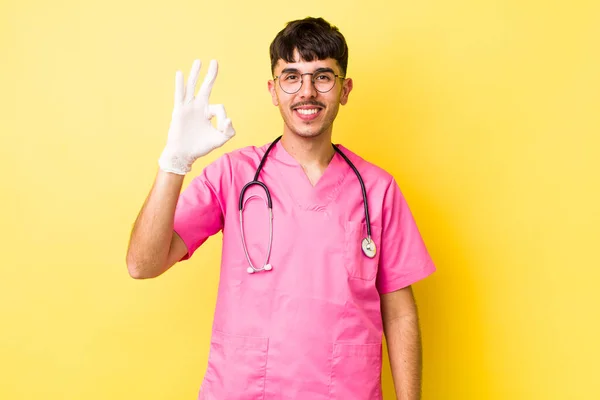 Young Hispanic Man Feeling Happy Showing Approval Okay Gesture Veterinarian — Stock Photo, Image