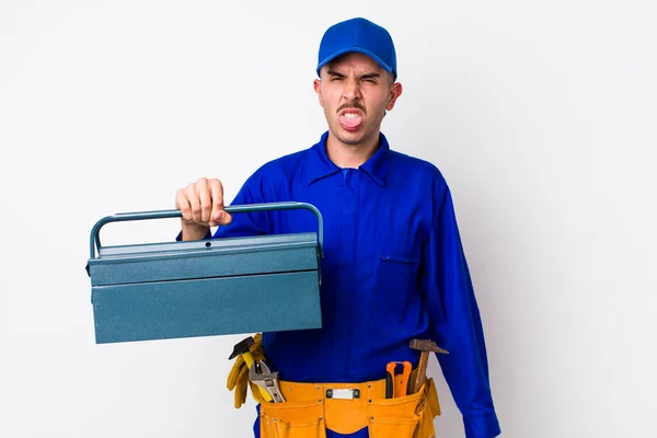 Young Hispanic Plumber Feeling Disgusted Irritated Tongue Out Toolbox Concept — Stock Photo, Image