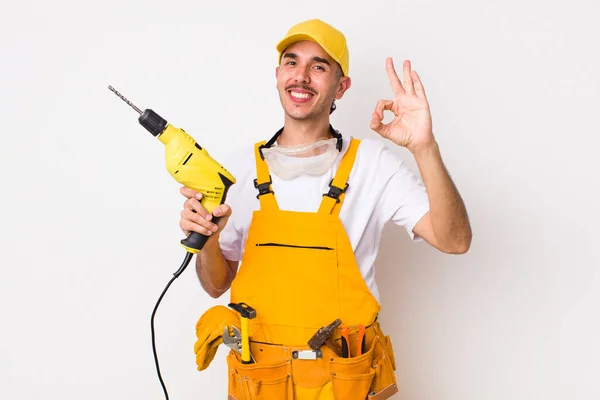 Hispanic Handyman Feeling Happy Showing Approval Okay Gesture Drill Concept — Stock Photo, Image