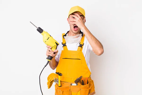 Hispanic Handyman Looking Shocked Scared Terrified Covering Face Hand Drill — Stock Photo, Image