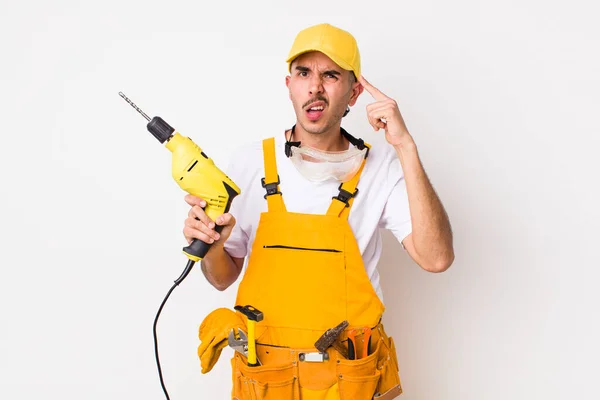 Hispanic Handyman Feeling Confused Puzzled Showing You Insane Drill Concept — Stock Photo, Image