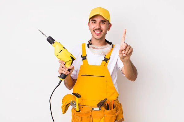 Hispanic Handyman Smiling Looking Friendly Showing Number One Drill Concept — Stock Photo, Image