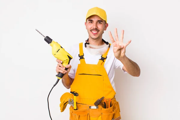 Hispanic Handyman Smiling Looking Friendly Showing Number Four Drill Concept — Stock Photo, Image