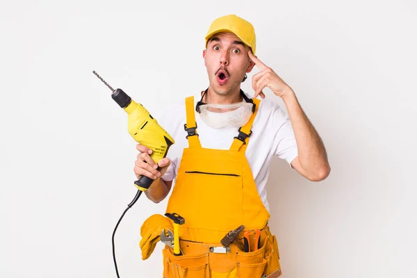 Hispanic Handyman Looking Surprised Realizing New Thought Idea Concept Drill — Stock Photo, Image