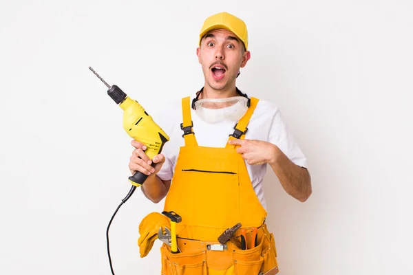 Hispanic Handyman Looking Shocked Surprised Mouth Wide Open Pointing Self — Stock Photo, Image