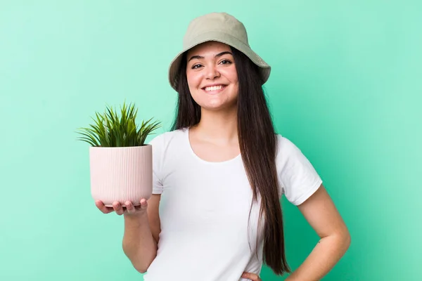 Young Adult Woman Smiling Happily Hand Hip Confident Plant Concept — Stock Photo, Image