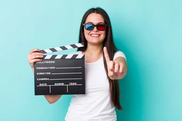 Young Adult Woman Smiling Proudly Confidently Making Number One Movie — Stockfoto