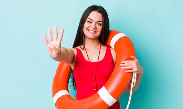 Young Adult Woman Smiling Looking Friendly Showing Number Four Lifeguard — Stock Photo, Image