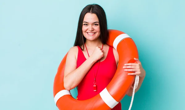 young adult woman feeling happy and facing a challenge or celebrating. lifeguard concept