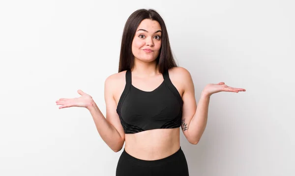 Jonge Volwassen Vrouw Voelt Zich Verward Verward Twijfelend Fitness Concept — Stockfoto