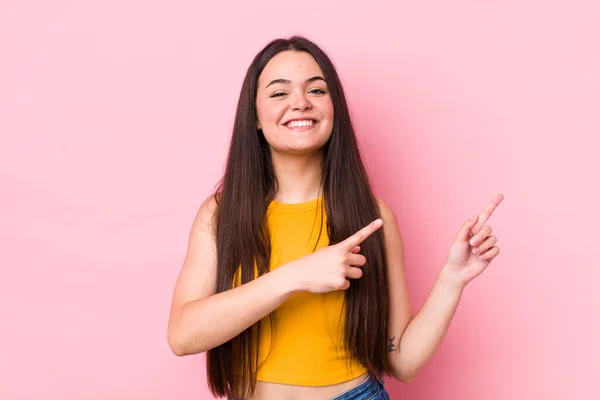 Young Adult Woman Smiling Happily Pointing Side Upwards Both Hands — Stockfoto