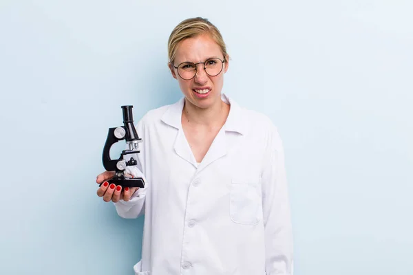 Young Adult Blonde Woman Feeling Puzzled Confused Scientist Microscope Concept — Stock Photo, Image