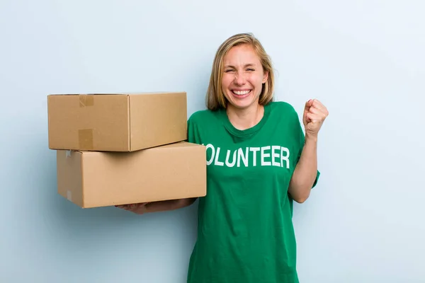 Young Adult Blonde Woman Feeling Shocked Laughing Celebrating Success Volunteer — Stockfoto