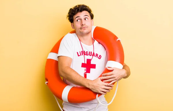 Young Handsome Guy Shrugging Feeling Confused Uncertain Lifeguard Concept — Stock Photo, Image