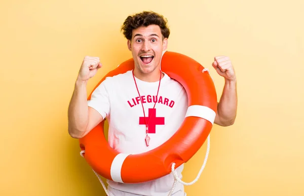 Young Handsome Guy Feeling Shocked Laughing Celebrating Success Lifeguard Concept — Stock Photo, Image