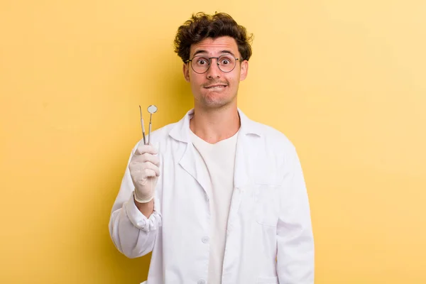 Young Handsome Guy Looking Puzzled Confused Dentist Concept — Stockfoto