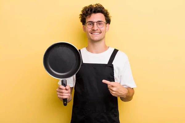 Young Handsome Guy Smiling Cheerfully Feeling Happy Pointing Side Chef — Stock Photo, Image