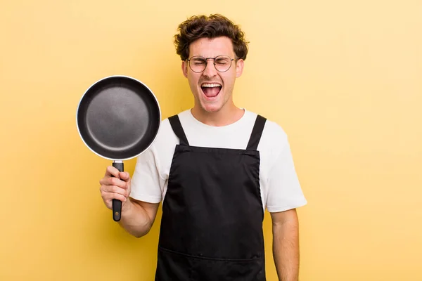 Young Handsome Guy Shouting Aggressively Looking Very Angry Chef Pan — Stock Photo, Image