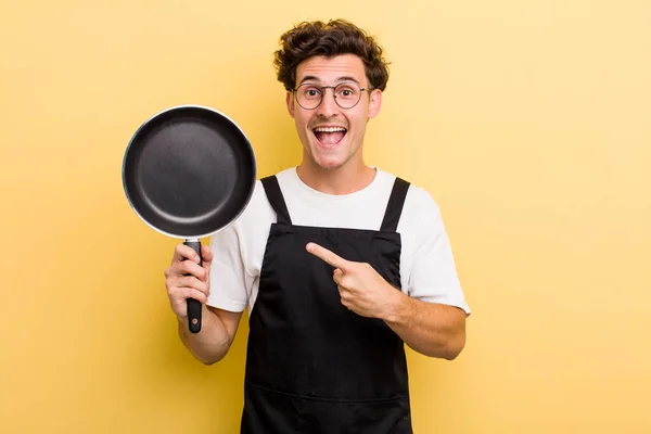 Young Handsome Guy Looking Excited Surprised Pointing Side Chef Pan — Stock Photo, Image
