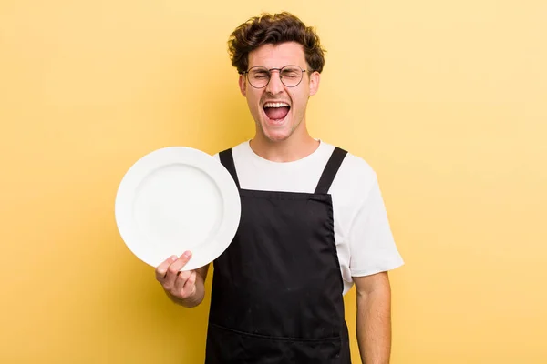 Young Handsome Guy Shouting Aggressively Looking Very Angry Empty Dish — Stock Photo, Image