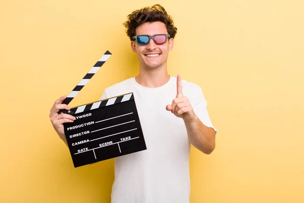 Young Handsome Guy Smiling Proudly Confidently Making Number One Movie — Stockfoto
