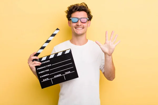 Young Handsome Guy Smiling Looking Friendly Showing Number Five Movie — Stockfoto
