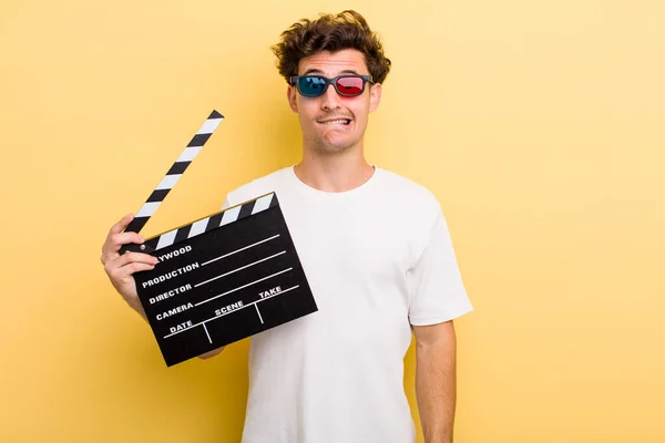 Young Handsome Guy Looking Puzzled Confused Movie Concept — Stockfoto