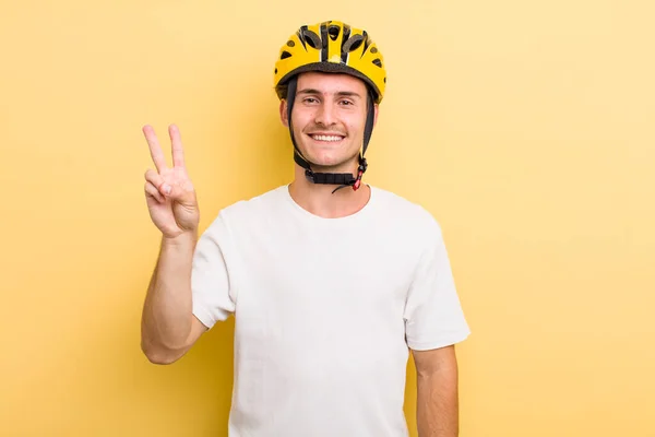Young Handsome Guy Smiling Looking Friendly Showing Number Two Bike — Stockfoto