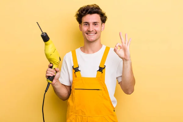 Young Handsome Guy Feeling Happy Showing Approval Okay Gesture Handyman — Stockfoto