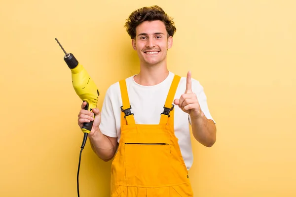 Young Handsome Guy Smiling Proudly Confidently Making Number One Handyman — Stockfoto