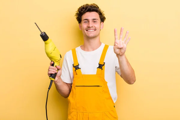 Young Handsome Guy Smiling Looking Friendly Showing Number Four Handyman — Stock Photo, Image