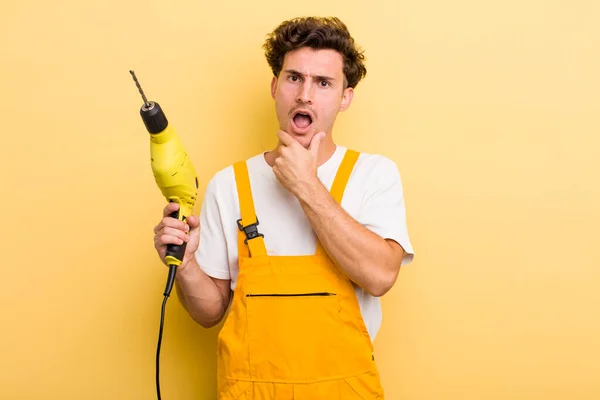 Young Handsome Guy Mouth Eyes Wide Open Hand Chin Handyman — Stock Photo, Image