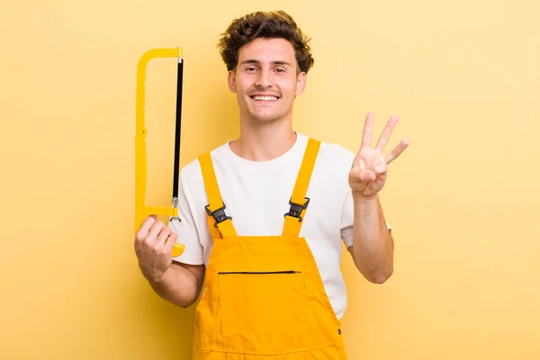 Jovem Bonito Cara Sorrindo Olhando Amigável Mostrando Número Três Faz — Fotografia de Stock