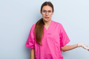 young adult woman looking puzzled and confused. nurse concept