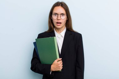 young adult woman looking very shocked or surprised. university student concept