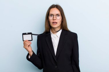 young adult woman looking very shocked or surprised. vip pass id concept