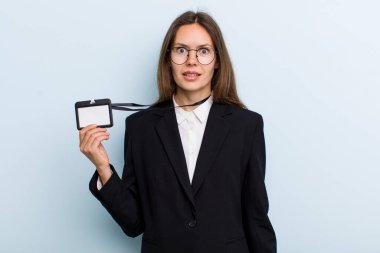 young adult woman looking happy and pleasantly surprised. vip pass id concept