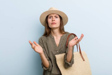 young adult woman looking desperate, frustrated and stressed. summer concept