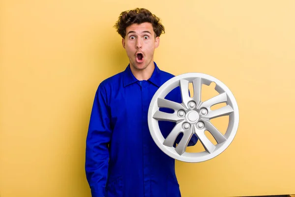 Young Handsome Teenager Looking Very Shocked Surprised Car Mechanic Concept — Stock Fotó