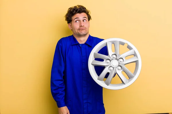 Young Handsome Teenager Shrugging Feeling Confused Uncertain Car Mechanic Concept — Fotografia de Stock