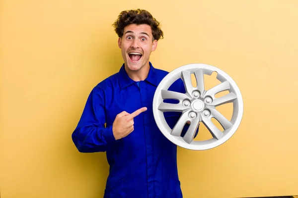 Young Handsome Teenager Looking Excited Surprised Pointing Side Car Mechanic — Stock Fotó